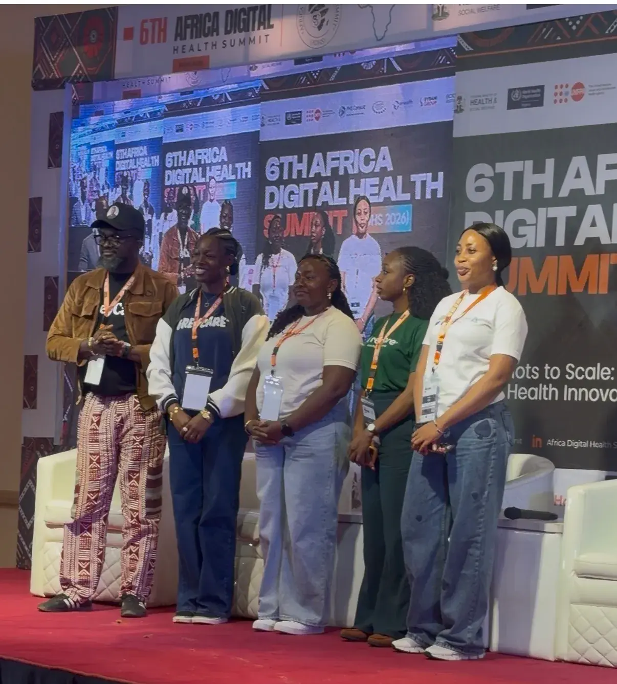 AISHA team on stage with the ADHS 2026 summit backdrop